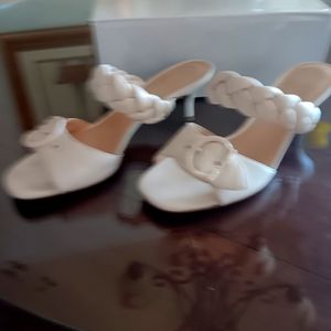 Coach White slip on heels. Perfect for that casual day. Adjustable front strap